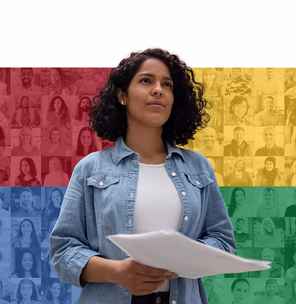 Woman holding a tablet while standing in front of a colorful four-quadrant background representing personality types and diversity