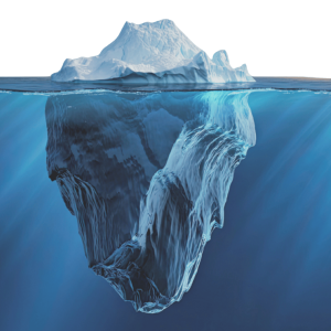 Iceberg partially submerged in ocean water, showing visible tip above surface and large underwater mass below