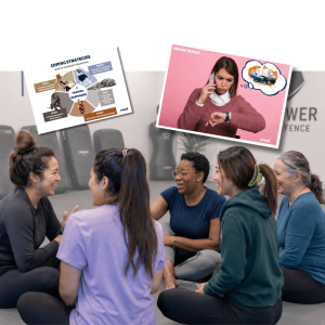 Diverse group of employees in conversation with wellbeing program materials visible, including healthy coping strategies and family values posters on wall