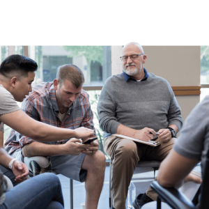 Group of diverse employees in team discussion during workplace wellbeing program activity