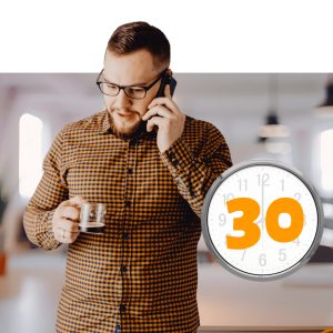 Man in glasses and checkered shirt on phone holding coffee with clock showing 30-minute duration overlay