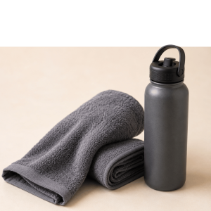 Blue towels and water bottle for workout recovery and hydration