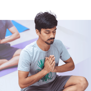 Man performing a guided breathing or meditation exercise with hands placed on chest in a calm, mindful posture